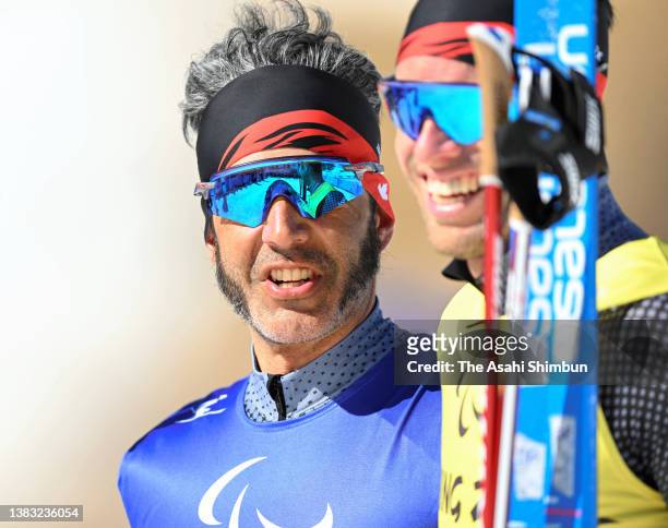 Gold medalist Brian McKeever of Team Canada poses with his guide Russell Kennedy after finishing in the Para Cross-Country Skiing Men's Long Distance...