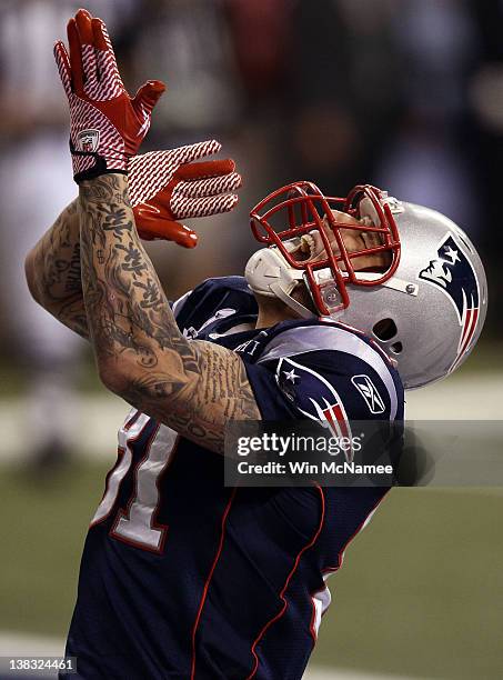 Aaron Hernandez of the New England Patriots celebrates a 12 yard touchdown in the third quarter against the New York Giants during Super Bowl XLVI at...