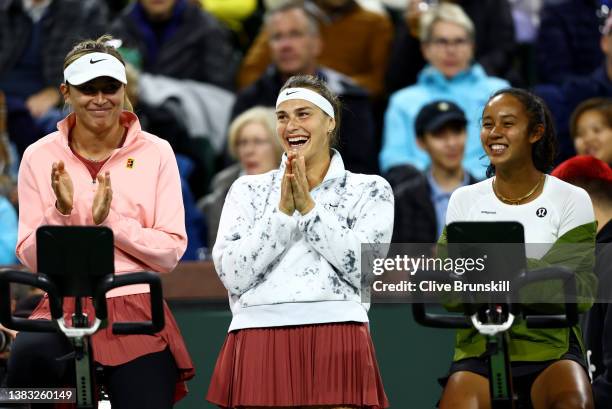 Paula Badosa of Spain, Aryna Sabalenka of Belarus and Leylah Annie Fernandez of Canada react whilst watching a match during the Eisenhower Cup, a Tie...