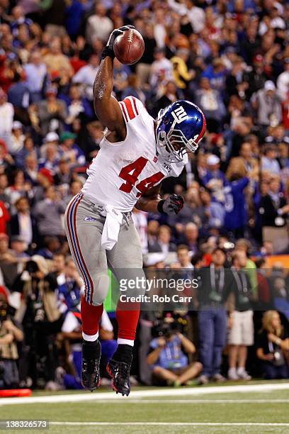 Fullback Ahmad Bradshaw of the New York Giants celebrates his six-yard touchdown run in the fourth quarter against the New England Patriots during...
