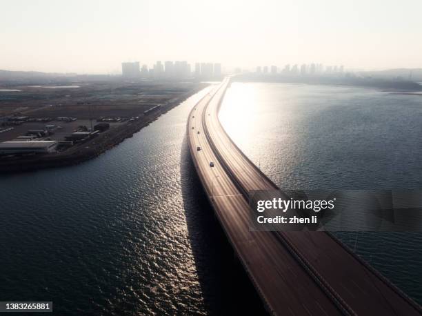 aerial view of cross-sea bridge - asphalt textur ohne personen stock-fotos und bilder