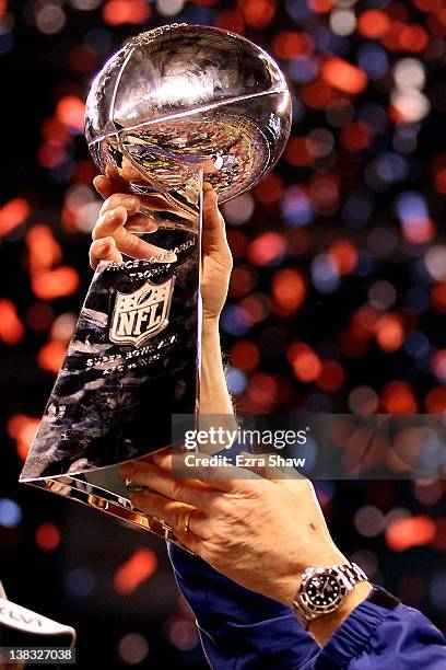 Head coach Tom Coughlin of the New York Giants poses with the Vince Lombardi Trophy after the Giants defeated the Patriots by a score of 21-17 in...