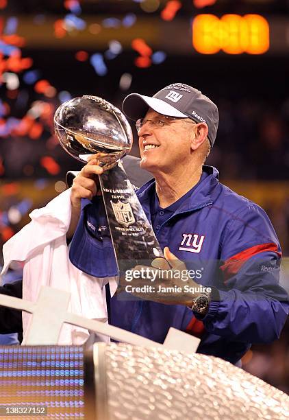 Head coach Tom Coughlin of the New York Giants celebrates with the Vince Lombardi Trophy after defeating the New England Patriots in Super Bowl XLVI...