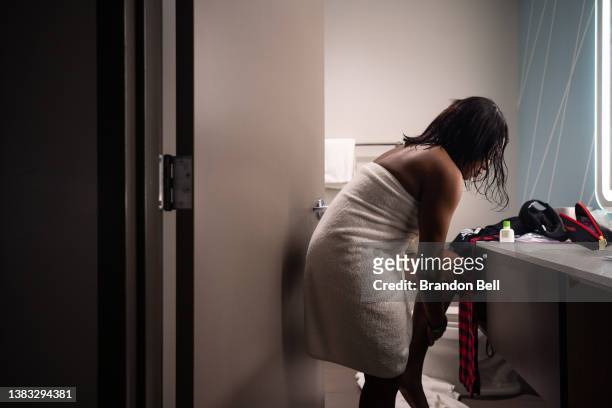 Munique Liggens applies beauty care products in her hotel room on March 08, 2022 in Montgomery, Alabama. "I traveled here from Texas to be a voice...