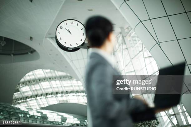 business woman&clock - checking watch stock pictures, royalty-free photos & images