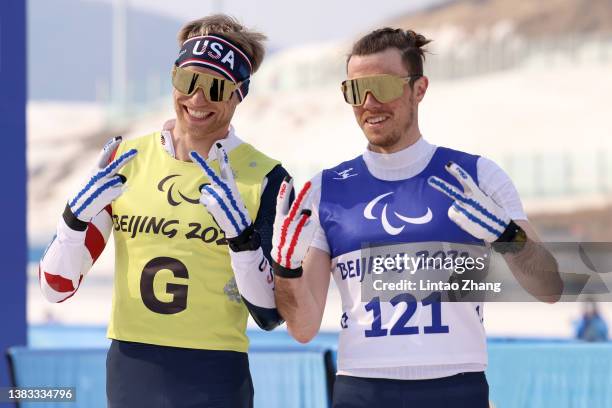 Silver medal winner Jake Adicoff of Team USA celebrates with his guide following the Men's Sprint Free Technique Vision Impaired Final on day five of...