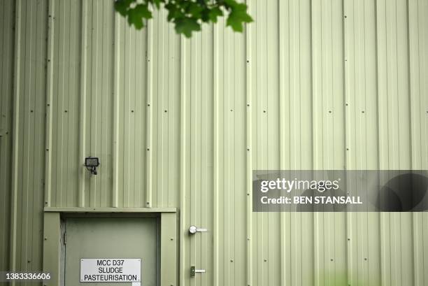 Sign on a door reads 'Sludge Pasteurisation' at Thames Water's Mogden sewage treatment works in Isleworth, west London, on July 2, 2023. The UK...