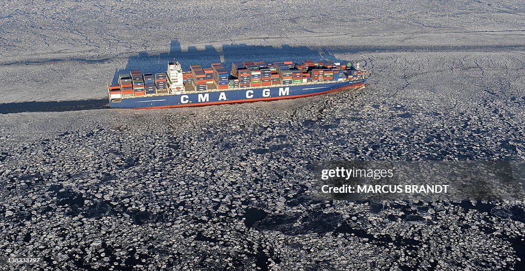 Contship Ice A freighter makes its way through ice sheets covering the water in ...