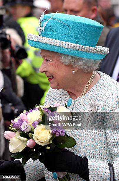 Queen Elizabeth II is greeted by wellwishers during a visit to Kings Lynn Town Hall on February 6, 2012 in Norfolk, England. Today is Accession Day,...