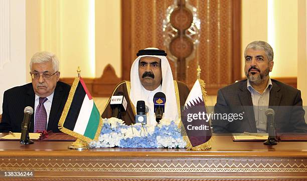 Qatari Emir Sheikh Hamad Bin Khalifa Al-Thani Palestinian President Mahmoud Abbas and Hamas leader Khaled Meshaal attend a ceremony in Doha, on...