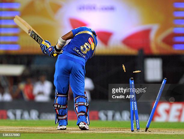 Mumbai Indians batsman Sarul Kanwar is bowled by Royal Challengers Bangalore bowler Dirk Nannes during the Champions League Twenty20 final match...
