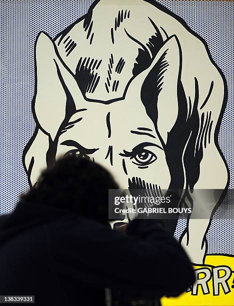 Visitors look at "Grrrrrrrrrrr !!" by US artist Roy lichtenstein belonging to the Guggenheim foundation, as part as an exhibition called "Guggenheim...