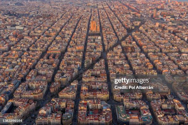 panorama aerial view of barcelona eixample residencial district and famous basilica, catalonia, spain. - estadio olímpico fotografías e imágenes de stock