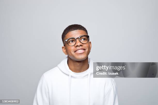 headshot of thoughtful young man - student thinking stock pictures, royalty-free photos & images