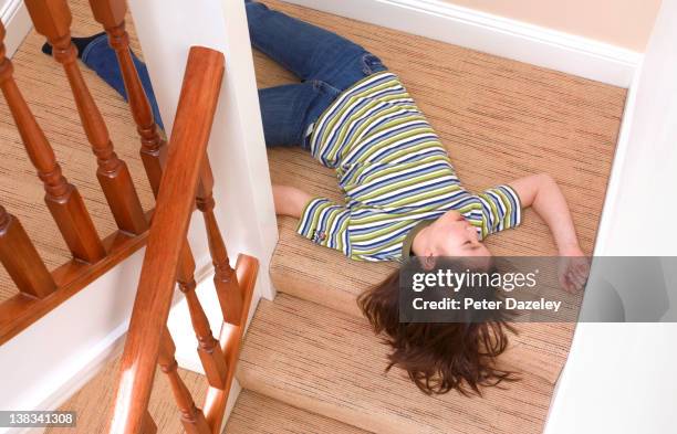 young girl fallen downstairs - unconscious fotografías e imágenes de stock