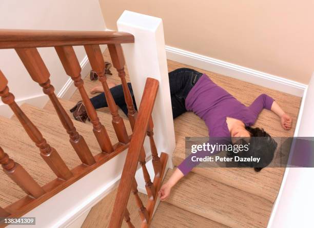 50 year old woman fallen downstairs - unconscious person stock pictures, royalty-free photos & images