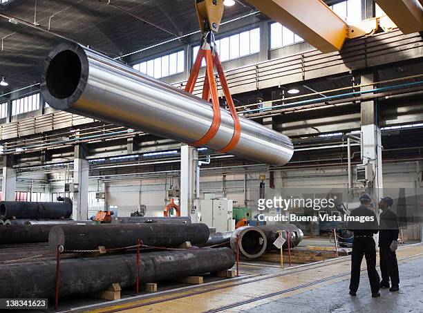 workers in a steel factory - manufacturing plant foto e immagini stock