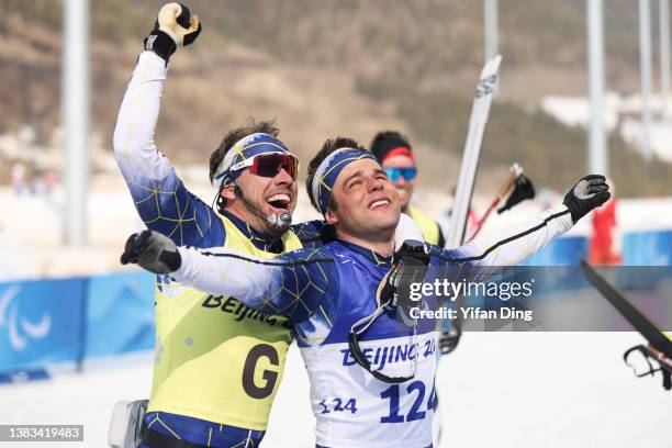 Bronze medalist Zebastian Modin of Team Sweden celebrates with his guide after finishing the Men's Sprint Free Technique Vision Impaired Final on day...