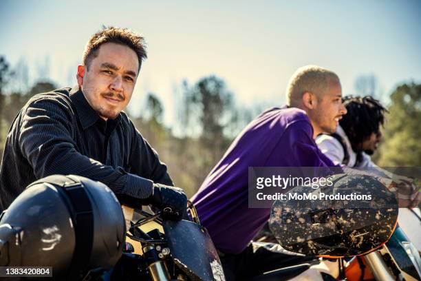 portrait of a group of dirt bikers - stuntman stock-fotos und bilder
