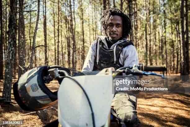 portrait of dirt biker with his motorcycle - moving image stock pictures, royalty-free photos & images