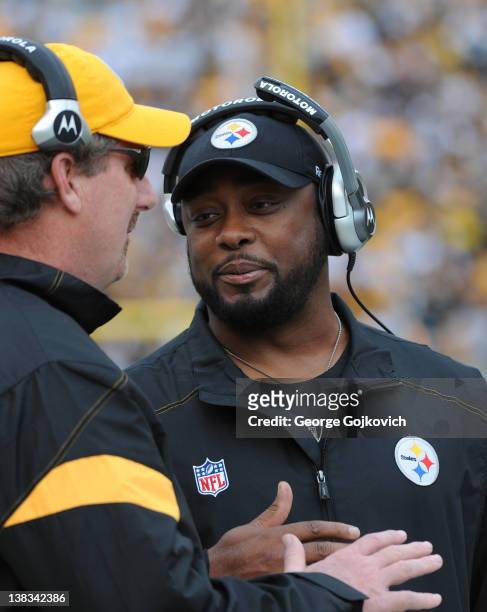 Head coach Mike Tomlin of the Pittsburgh Steelers talks with linebackers coach Keith Butler during a game against the Cincinnati Bengals at Heinz...