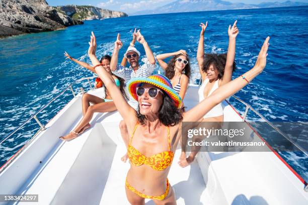 friends yachting in zakynthos greece - navagio beach and having fun traveling - luxury yachts stockfoto's en -beelden