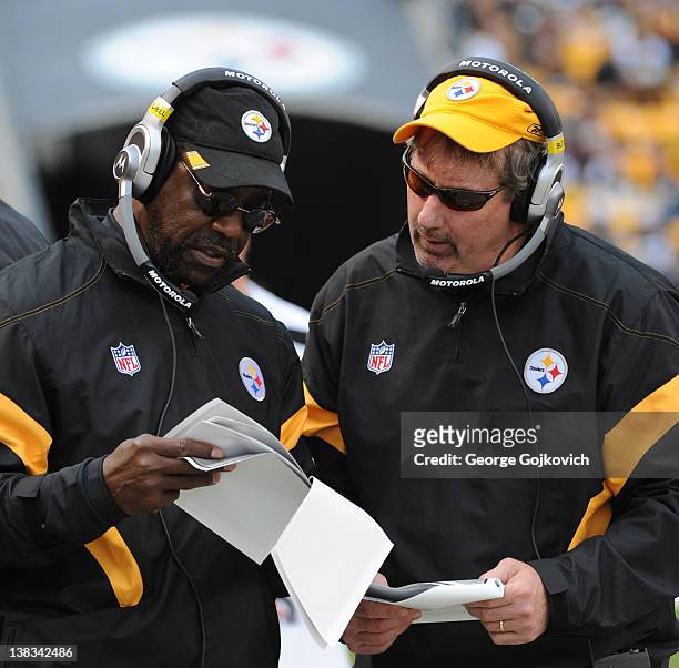 Assistant head coach John Mitchell and linebackers coach Keith Butler of the Pittsburgh Steelers confer on the sideline during a game against the...