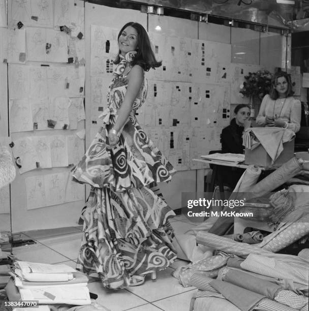 Model wearing a dress designed by Karl Lagerfeld for Chloé, UK, October 1974.
