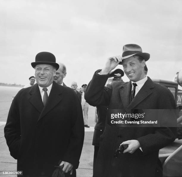 King Olav V of Norway and his son Prince Harald arrive at London Airport for the wedding of Princess Alexandra and Angus Ogilvy, UK, 22nd April 1963.