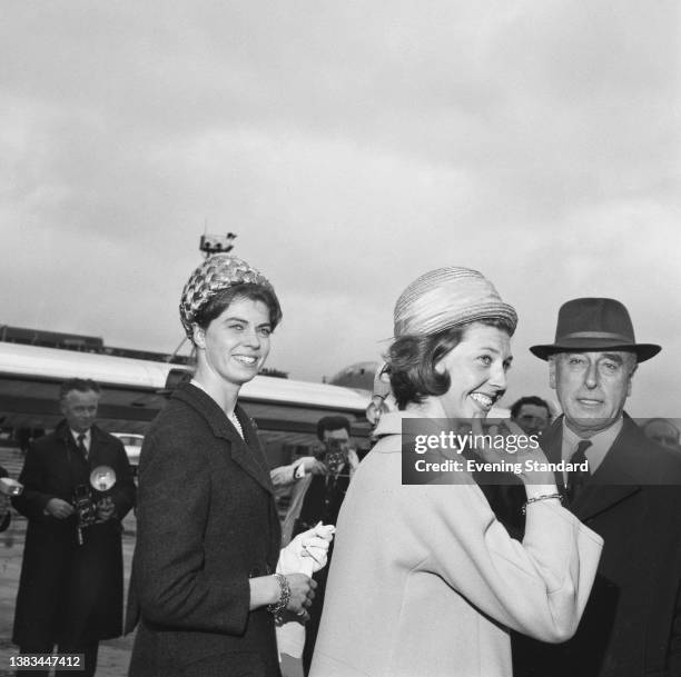 Princess Désirée of Sweden and Princess Margaretha of Sweden are met by Lord Louis Mountbatten as they arrive at London Airport for the wedding of...