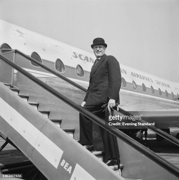 King Olav V of Norway leaves London Airport after attending the wedding of Princess Alexandra and Angus Ogilvy, UK, 29th April 1963.