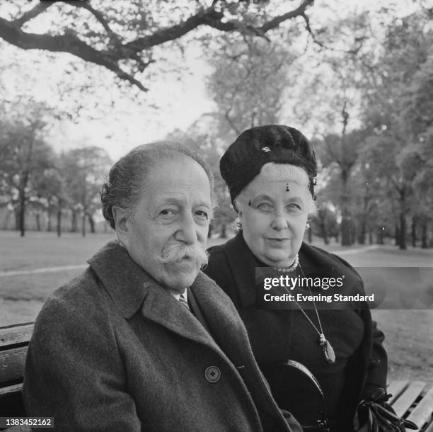 French conductor Pierre Monteux and his wife Doris in Hyde Park, London, UK, 18th May 1963. Monteux is in London to lead the LSO in a 50th...