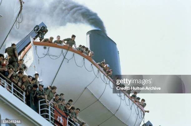 Some of the 3000 British troops, who are leaving Southampton on board the liner RMS Queen Elizabeth 2 on their way to South Georgia during the...