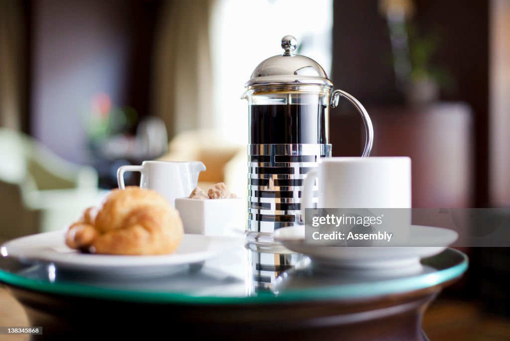 A room service breakfast tray in a hotel room