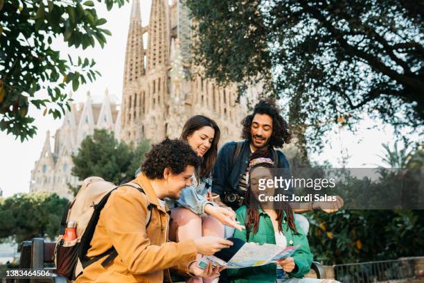 group of tourists in barcelona - sagrarda familia stock pictures, royalty-free photos & images