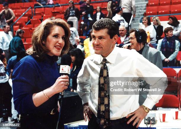 Italian-born American basketball coach Geno Auriemma of the University of Connecticut is interviewed by player Meghan Pattyson after a game, Storrs,...