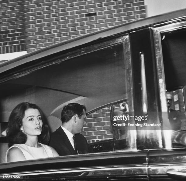 English model Christine Keeler with her manager Robin Drury, UK, 10th June 1963. John Profumo, the Secretary of State for War, had just admitted to...