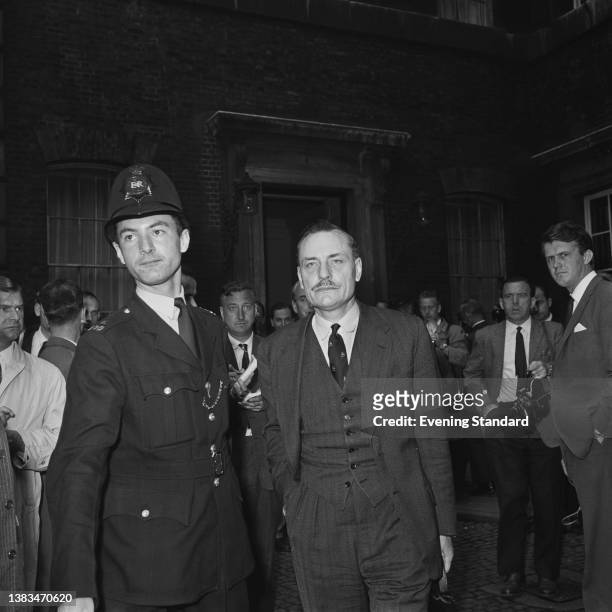 British Conservative politician Enoch Powell , the Minister of Health, attends a Cabinet meeting at Admiralty House in London during the Profumo...