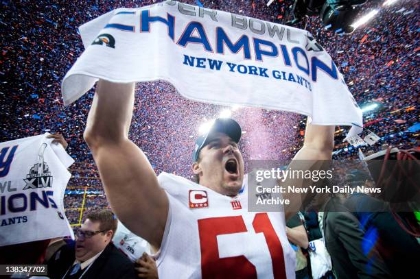 New York Giants against the New England Patriots in Superbowl XLVI at Lucas Oil Stadium in Indianapolis.Giants 21-17 win.The sign says it all! The...