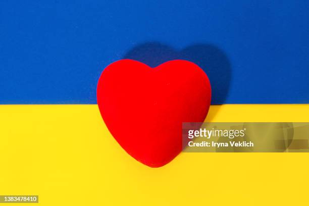 colours of national flag of ukraine - hostile planet stock-fotos und bilder