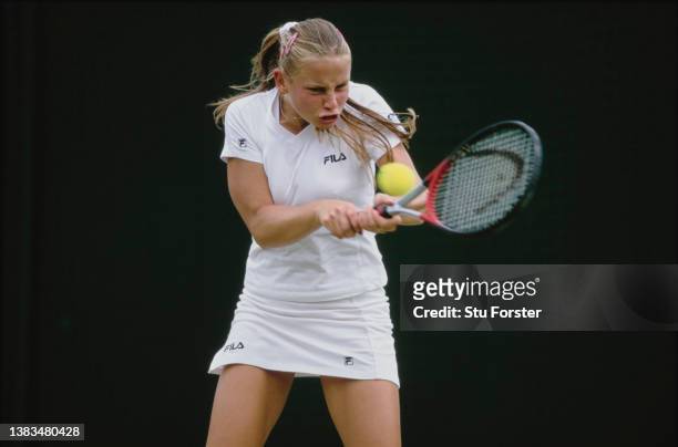 Jelena Dokic from Yugoslavia keeps her eye on the tennis ball playing a double handed backhand return against Gala Leon Garia of Spain during their...