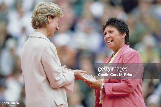 Birgitte, Duchess of Gloucester presents Rosemary "Rosie" Casals of the United States with a commemorative plate during a parade of former Wimbledon...