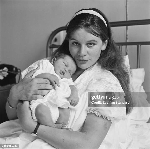 English actress Joanna Dunham with her baby daughter Abigail, UK, 26th July 1963.