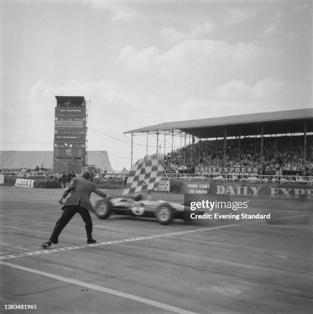 Scottish racing driver Jim Clark wins the 1963 British Grand Prix at Silverstone, in a Lotus Climax Lotus 25, UK, 20th July 1963.