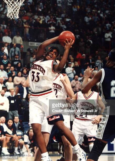 American basketball player Jamelle Elliott of the University of Connecticut with the ball during a game against Georgetown University, Storrs,...