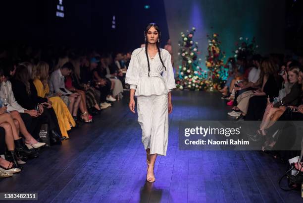 Model showcases designs by We Are Kindred during the Melbourne Fashion Festival Runway 3 show on March 09, 2022 in Melbourne, Australia.