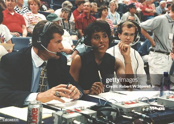 Network commentator Robin Roberts and Italian-born American basketball coach Geno Auriemma of the University of Connecticut broadcast an exhibition...