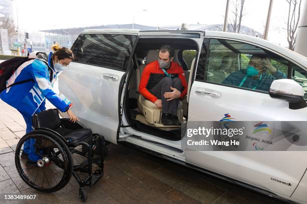 Volunteer service for International Paralympic Committee office teams use a special vehicle for the disabled during day 5 of the 2022 Beijing...