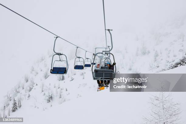 ski lift on top of the european alps - woman on ski lift stock pictures, royalty-free photos & images