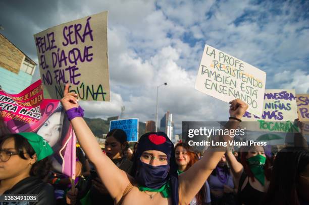 Women participate with posters and signs during the International Womens day demonstrations in Bogota, Colombia on March 8, 2022.